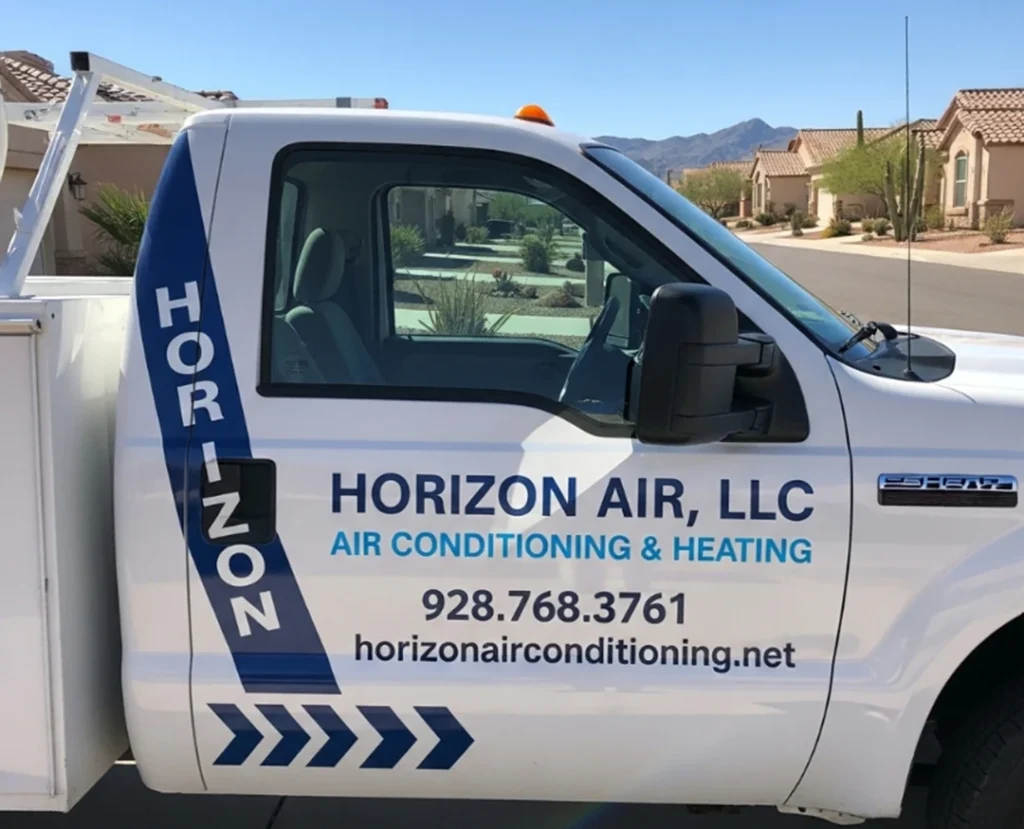 White pickup truck with "Horizon Air, LLC Air Conditioning & Heating" branding, phone number, website, and emergency AC repair services advertised on the door, parked on a suburban street.