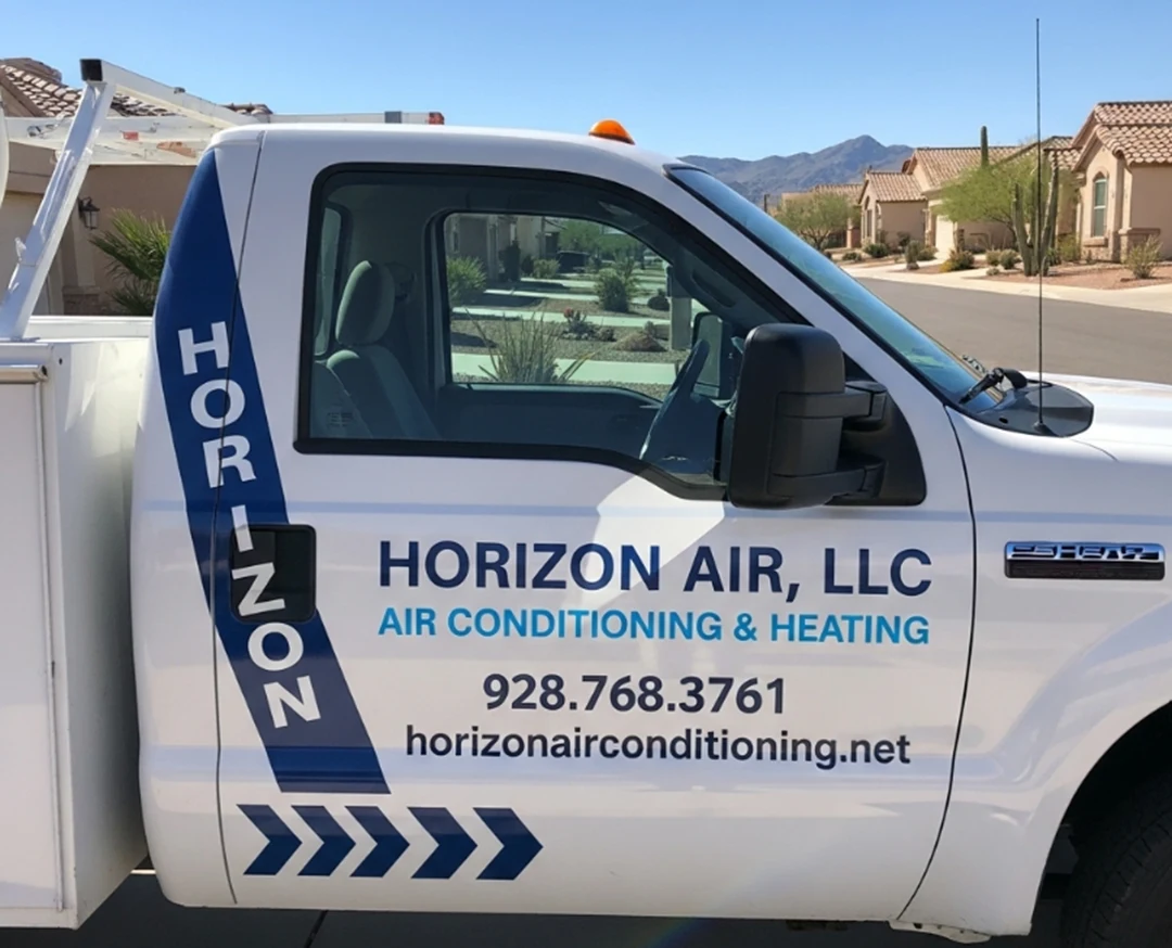 White Horizon Air, LLC service truck with company branding, contact number, and website parked on a residential street, ready to provide emergency AC repair when you need it most.